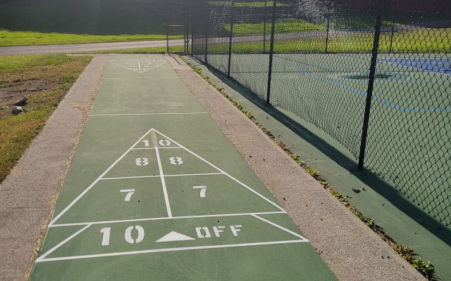 Tennis courts and outside games at the Stone Fence Resort