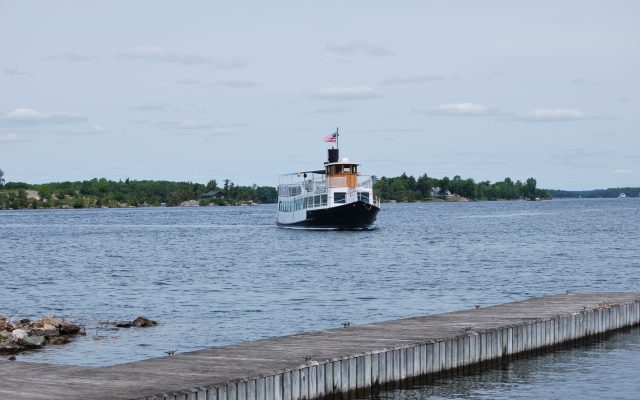 Uncle Sam Boat Tour Freedom one in the water come to a dock in the St. Lawrence River in the Thousand Islands